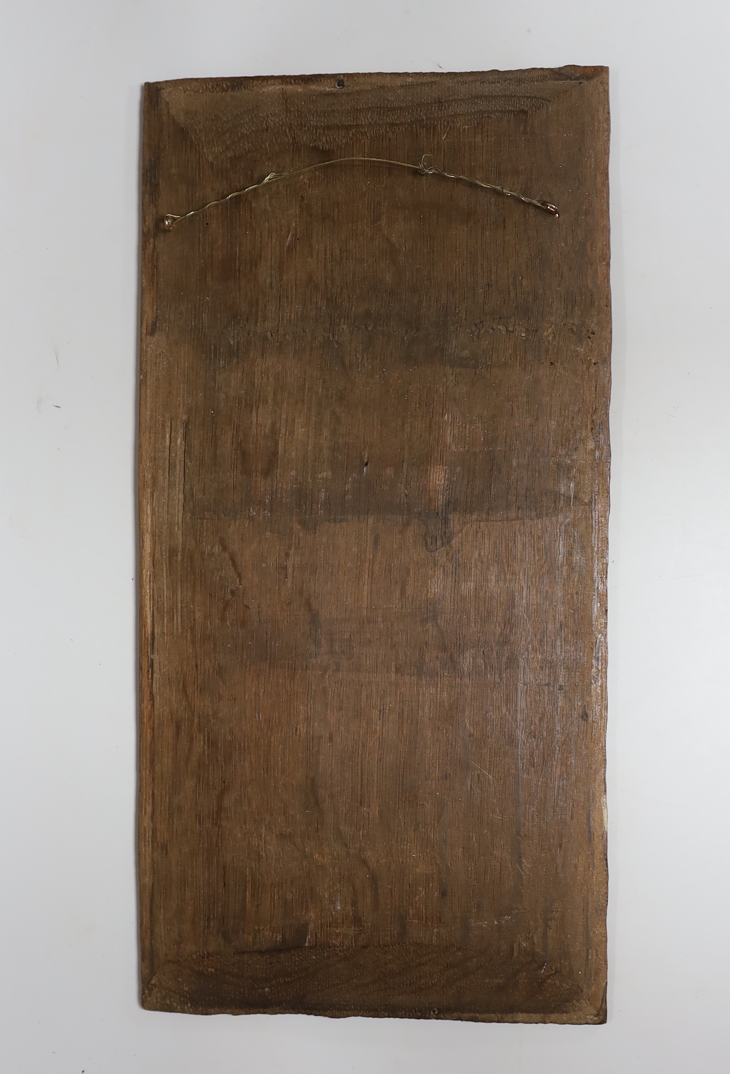A 17th century carved oak panel, 47x23cm